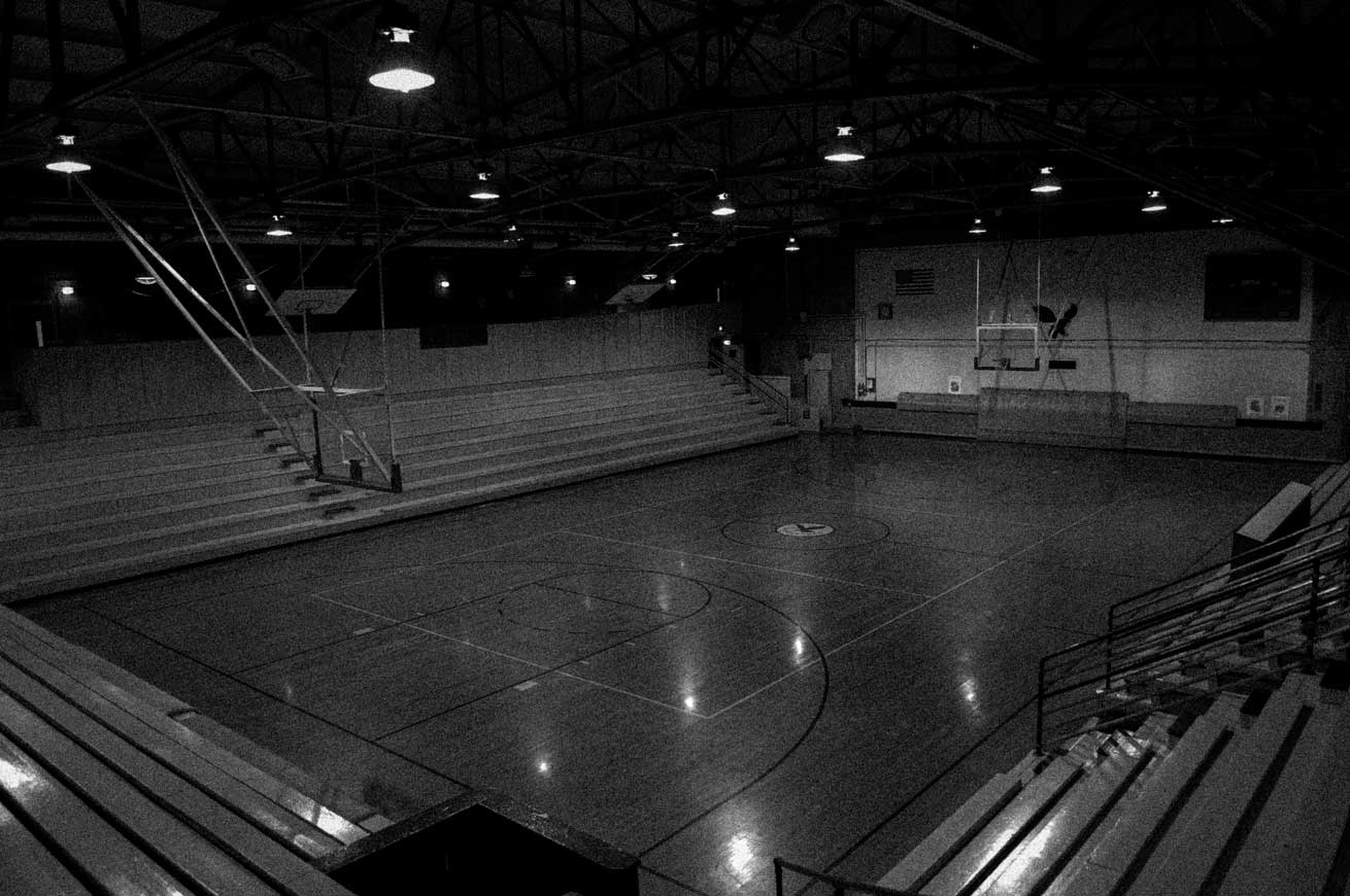 old distorted photo of high school basketball gymnasium